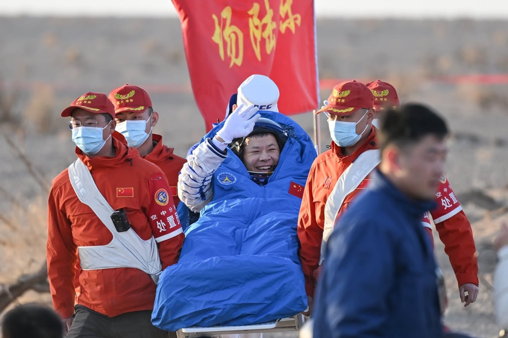 Astronaut Wang Jie waves as he is carried out of the Shenzhou-21 spaceship’s return capsule after it touched down at the Dongfeng landing site on Friday. Photo: Xinhua