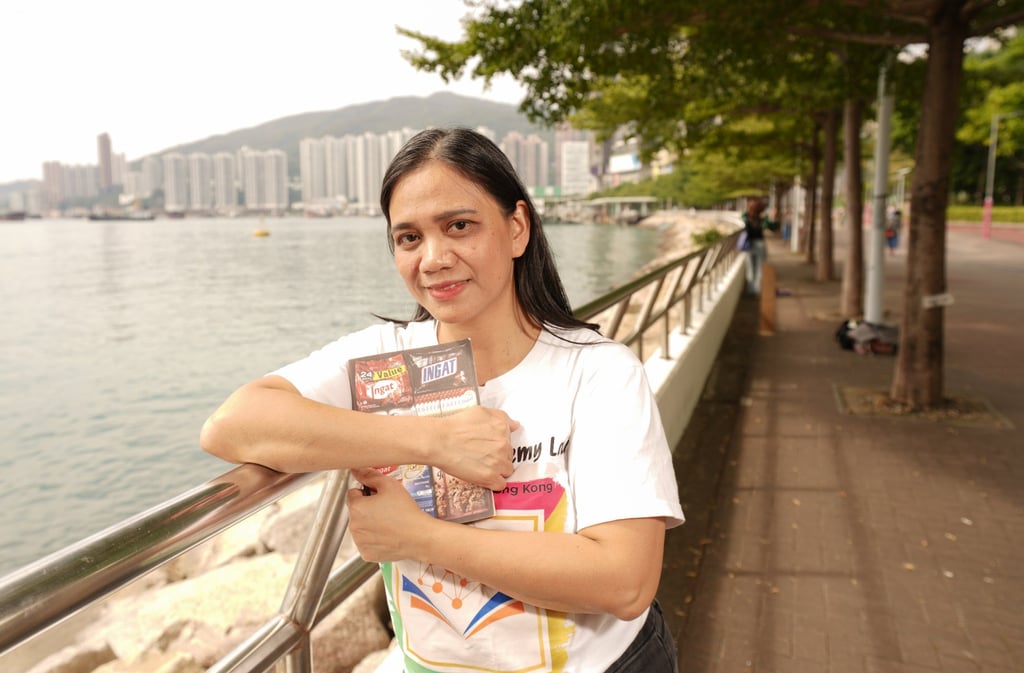 Maria Nemy Lou Rocio, with Ingat, an anthology of work by migrant domestic workers that she co-published with Small Tune Press, pictured in Tsuen Wan, Hong Kong. Photo: Alexander Mak