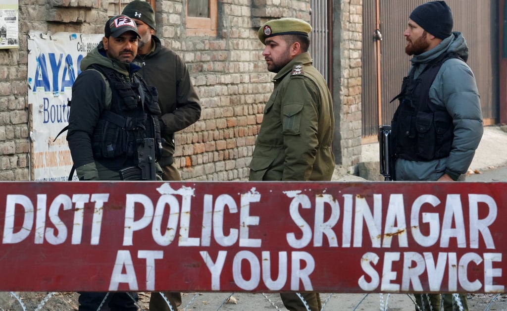Indian security forces stand guard at a barricade near the site of the explosion in India’s Kashmir on Saturday. Photo: Reuters Indian security forces stand guard at a barricade near the site of the explosion in India’s Kashmir on Saturday. Photo: Reuters