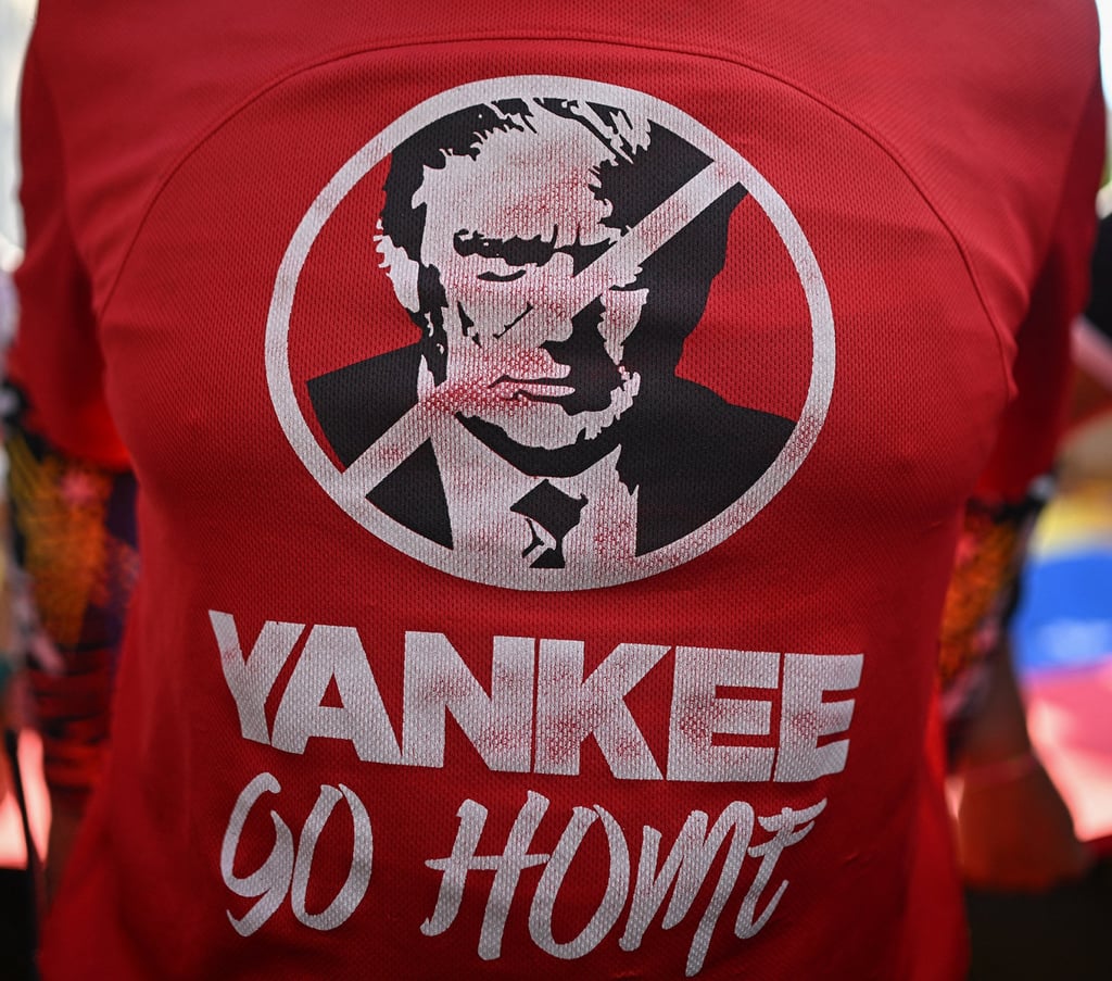 A supporter of Venezuelan President Nicolas Maduro wears a T-shirt depicting US President Donald Trump during a rally against US military activity in the Caribbean on October 30. Photo: AFP/ Getty Images A supporter of Venezuelan President Nicolas Maduro wears a T-shirt depicting US President Donald Trump during a rally against US military activity in the Caribbean on October 30. Photo: AFP/ Getty Images