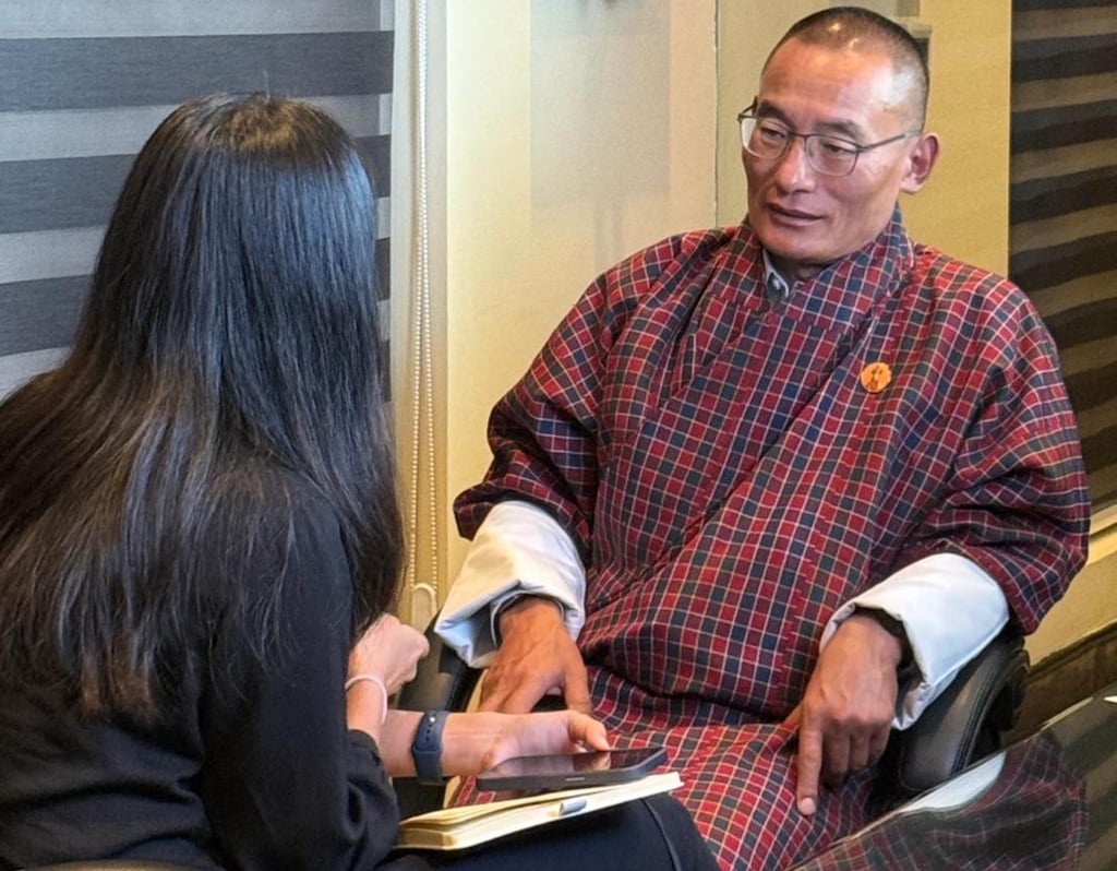Bhutanese Prime Minister Tshering Tobgay speaks to This Week in Asia reporter Jean Iau. Photo: Instagram/nor.mandala Bhutanese Prime Minister Tshering Tobgay speaks to This Week in Asia reporter Jean Iau. Photo: Instagram/nor.mandala