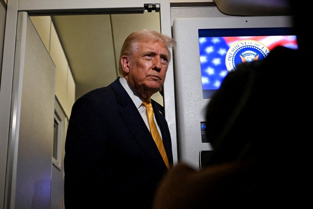 US President Donald Trump talks to members of the press on board Air Force One en route to Florida on Friday. Photo: Reuters US President Donald Trump talks to members of the press on board Air Force One en route to Florida on Friday. Photo: Reuters