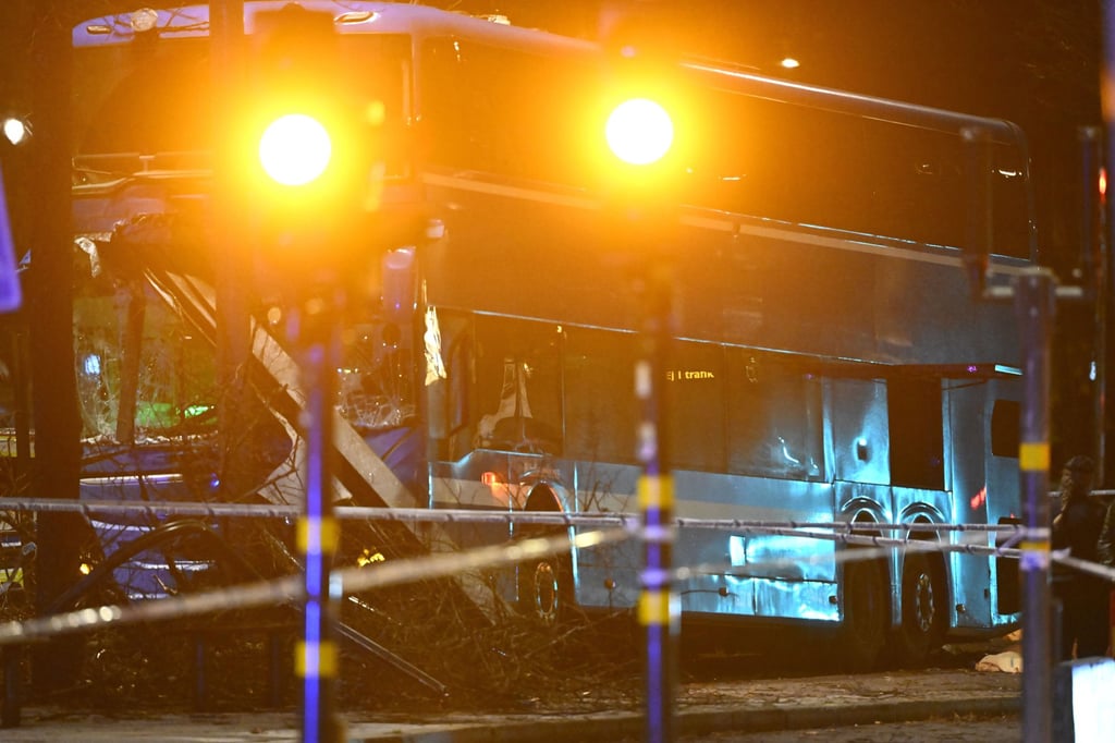 A damaged bus is seen after a crash at a bus shelter in Stockholm on Friday. Photo: TT News Agency via AP