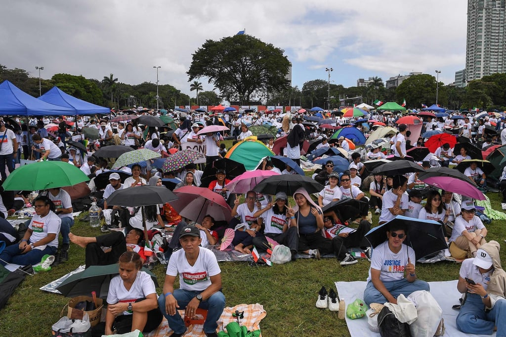 People take part in an anti-corruption protest in Manila on Sunday. Photo: AFP People take part in an anti-corruption protest in Manila on Sunday. Photo: AFP