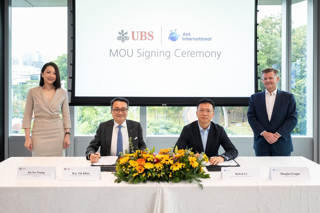 At the memorandum of understanding’s signing ceremony in Singapore: (from left) Young Jin Yee, co-head of UBS Global Wealth Management Asia-Pacific and country head for Singapore; Kay Tin Khoo, head of corporate institutional clients Asia-Pacific at UBS; Kelvin Li, general manager of platform tech at Ant International; and Douglas Feagin, president of Ant International. Photo: Handout At the memorandum of understanding’s signing ceremony in Singapore: (from left) Young Jin Yee, co-head of UBS Global Wealth Management Asia-Pacific and country head for Singapore; Kay Tin Khoo, head of corporate institutional clients Asia-Pacific at UBS; Kelvin Li, general manager of platform tech at Ant International; and Douglas Feagin, president of Ant International. Photo: Handout