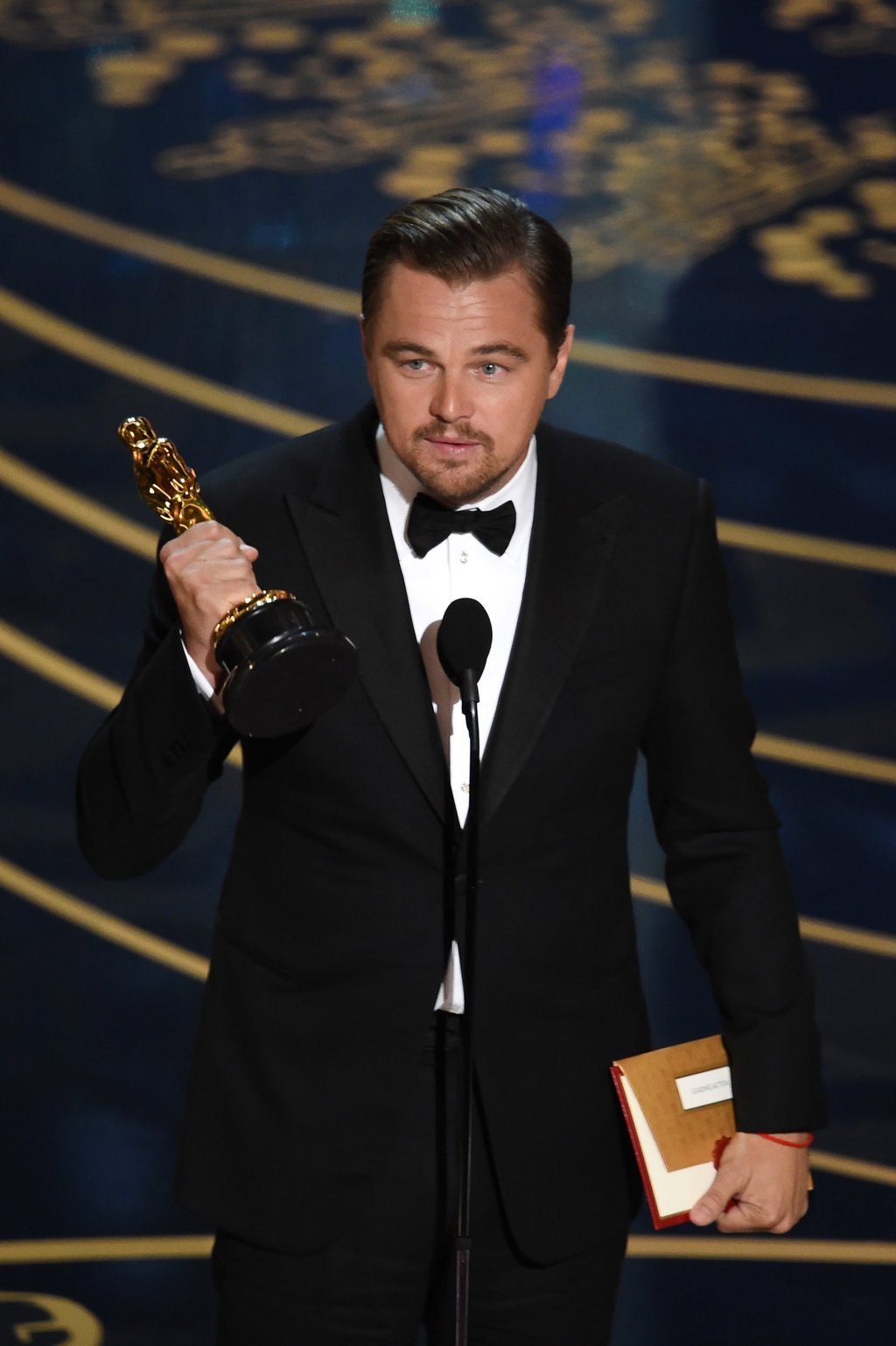 Leonardo DiCaprio accepts the best actor award during the 88th Annual Academy Awards in February 2016. Photo: Getty Images