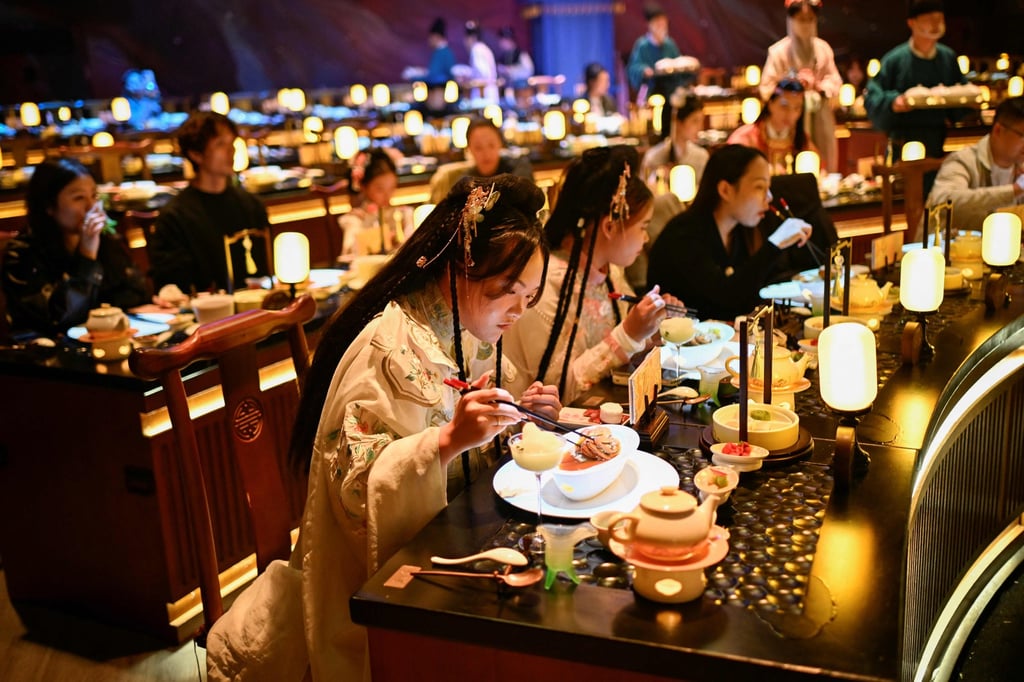 Diners dressed in traditional Chinese clothes eat at Yan Wai Yan in Beijing. Photo: AFP