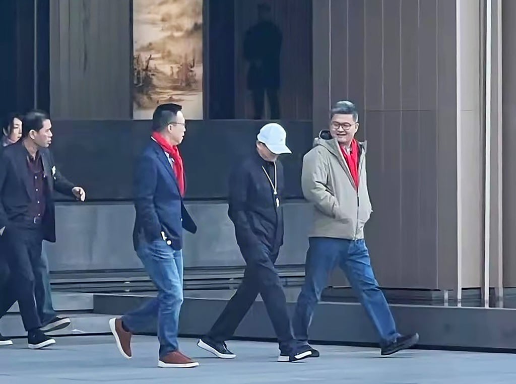 Jack Ma, wearing a white cap, is flanked by Ant Group chairman Eric Jing Xiandong (left) and CEO Cyril Han Xinyi during his walk around the Chinese fintech giant’s campus in Hangzhou, capital of eastern Zhejiang province. Photo: Handout.