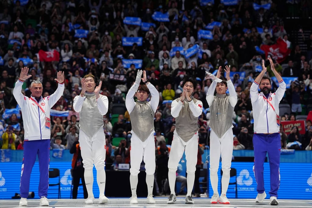 Hong Kong’s fencers and coaches applaud the fans after beating Fujian. Photo: Elson Li Hong Kong’s fencers and coaches applaud the fans after beating Fujian. Photo: Elson Li