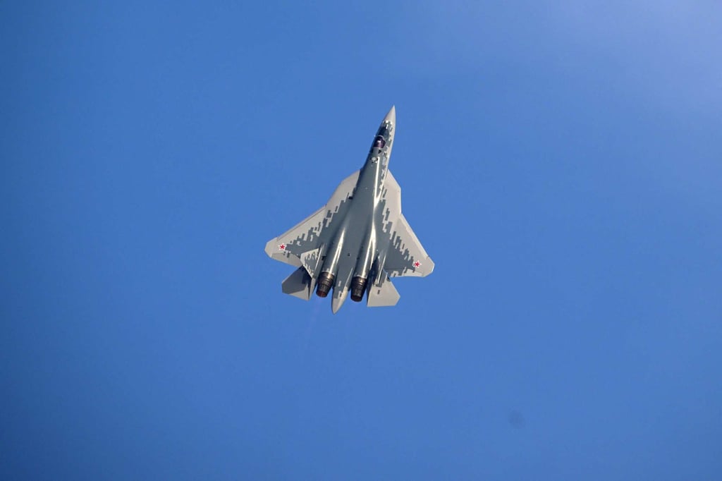 A Sukhoi SU-57E displays its capabilities above Al-Maktoum International Airport on Monday as part of the Dubai Air Show. Photo: AFP