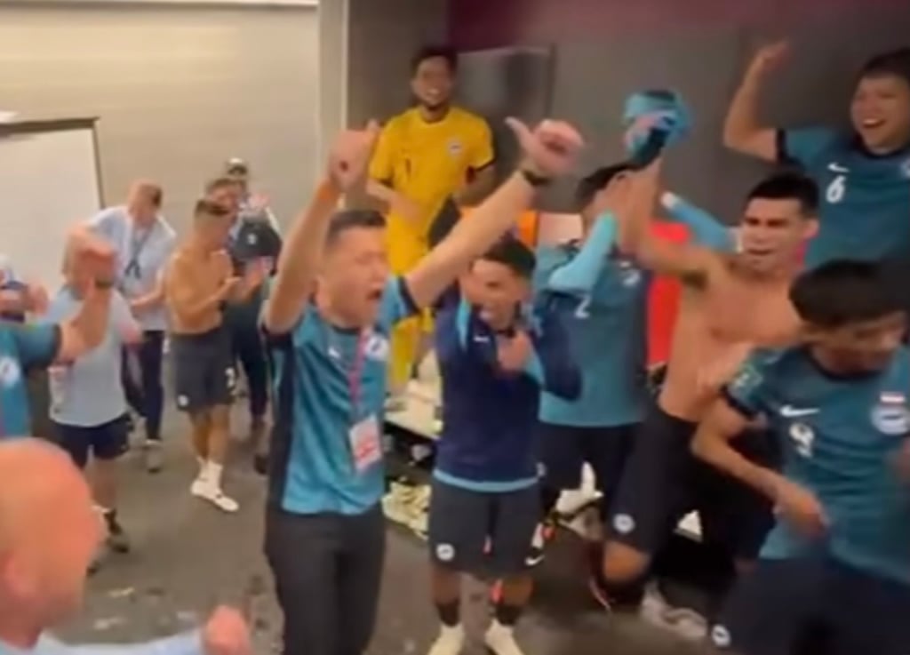 Singapore’s Acting Minister for Culture, Community and Youth David Neo speaking to Singapore’s national football team in a locker room after their win over Hong Kong in an Asian Cup qualifier match on Tuesday. Photo: Facebook/David Neo