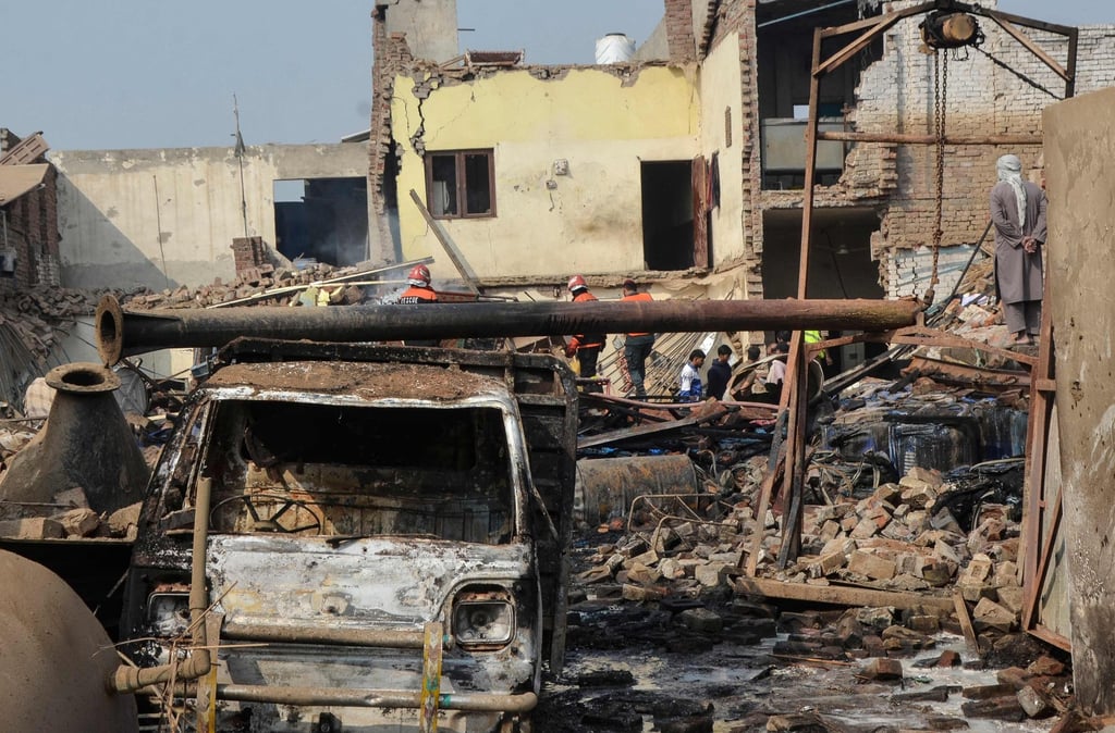 Rescuers search through the rubble after a boiler exploded at a glue-manufacturing factory on Friday. Photo: AFP Rescuers search through the rubble after a boiler exploded at a glue-manufacturing factory on Friday. Photo: AFP