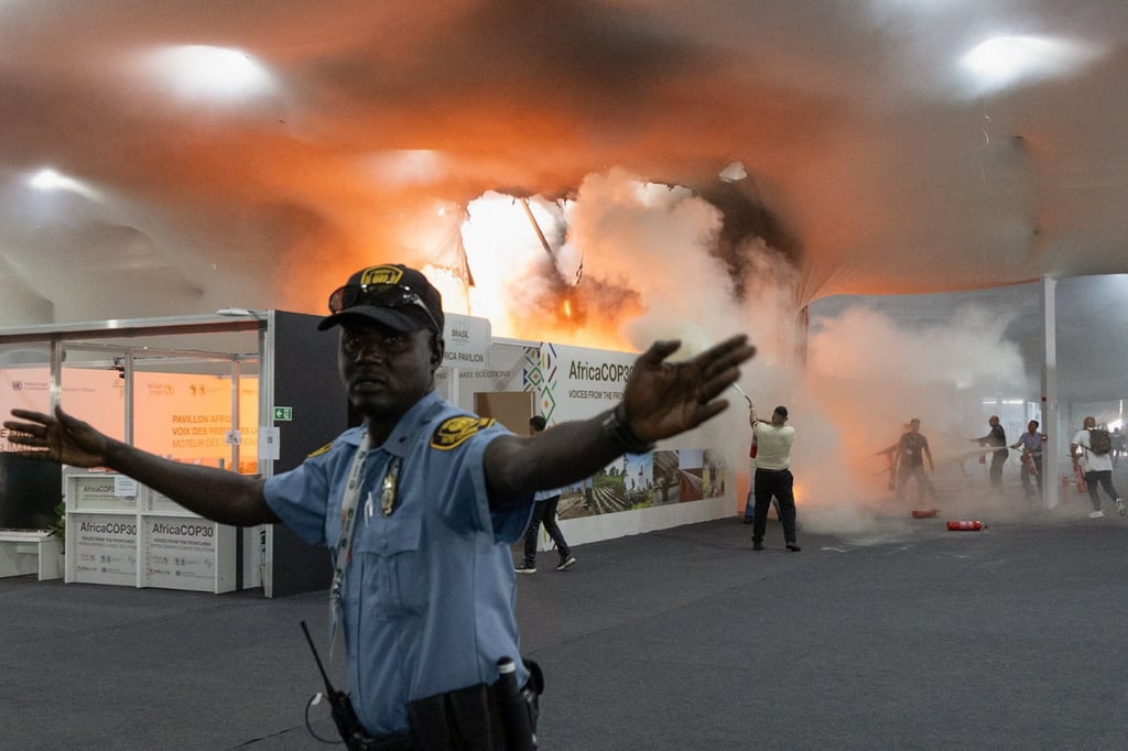 People use fire extinguishers to put out the fire. Photo: Reuters People use fire extinguishers to put out the fire. Photo: Reuters