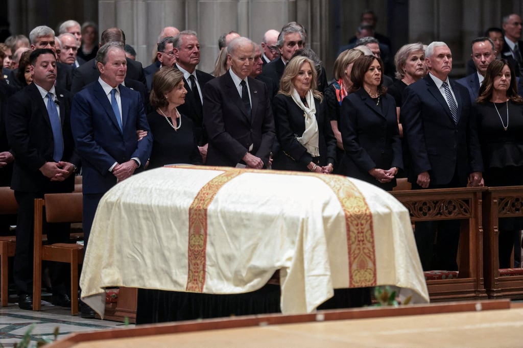 Former US presidents George W. Bush and Joe Biden and other guests at the funeral. Photo: Reuters Former US presidents George W. Bush and Joe Biden and other guests at the funeral. Photo: Reuters