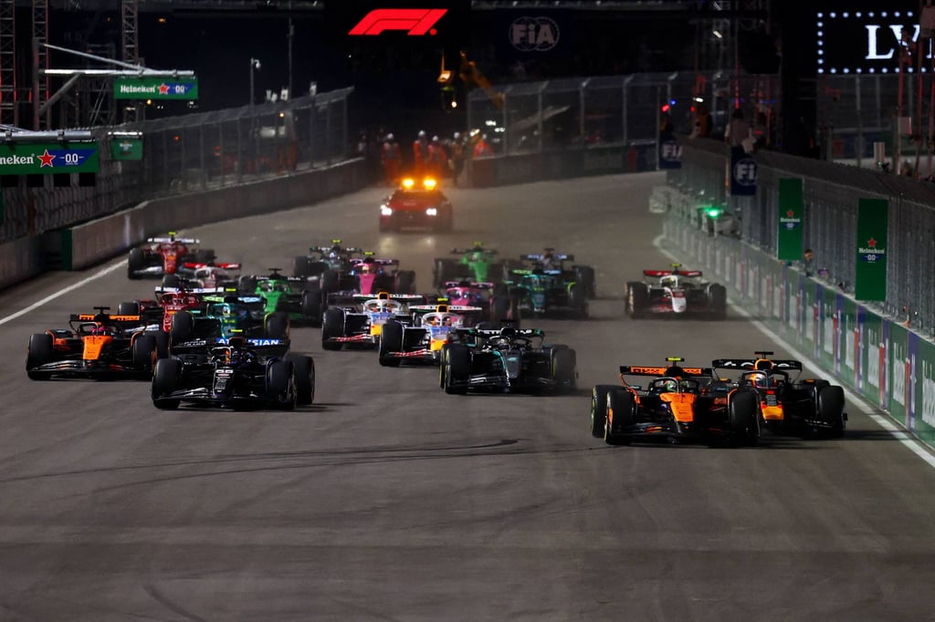 Lando Norris and Max Verstappen battle for position at the start. Photo: Getty Images Lando Norris and Max Verstappen battle for position at the start. Photo: Getty Images