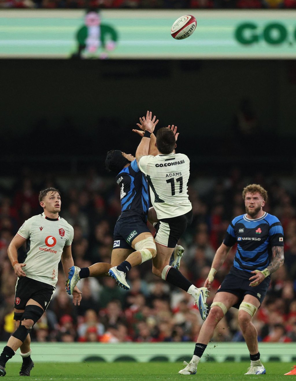 Japan’s Kippei Ishida (middle left) and Wales’ Josh Adams compete for a high ball. Photo: AFP Japan’s Kippei Ishida (middle left) and Wales’ Josh Adams compete for a high ball. Photo: AFP