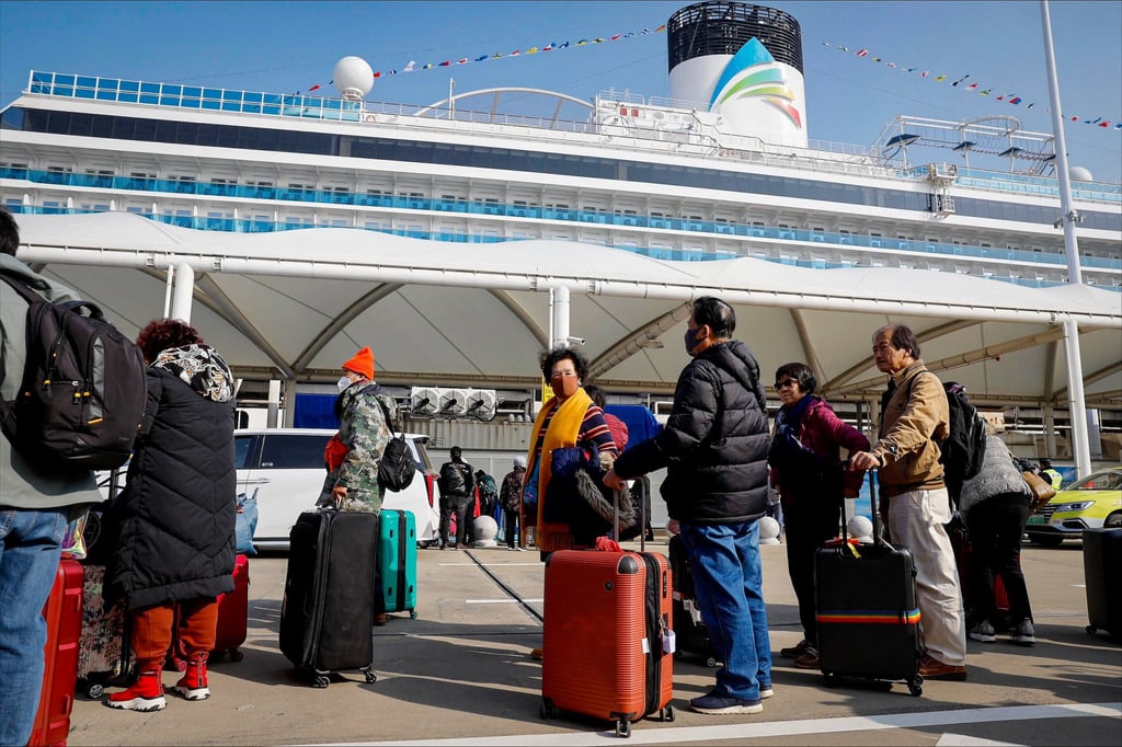Passengers wait to board the Adora Magic City, in Shanghai, China. Photo: AFP Passengers wait to board the Adora Magic City, in Shanghai, China. Photo: AFP