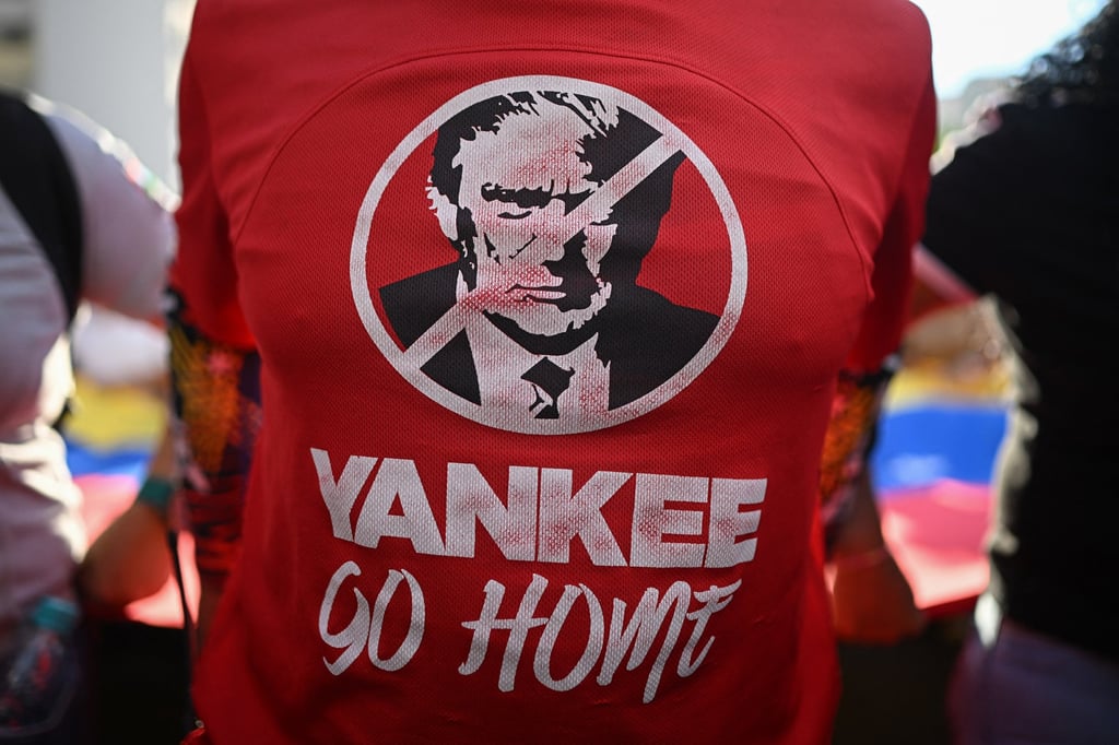 A T-shirt depicting US President Donald Trump with the slogan “Yankee go home” is worn by a Maduro supporter during a rally against US military activity in the Caribbean, in Caracas last month. Photo: TNS A T-shirt depicting US President Donald Trump with the slogan “Yankee go home” is worn by a Maduro supporter during a rally against US military activity in the Caribbean, in Caracas last month. Photo: TNS