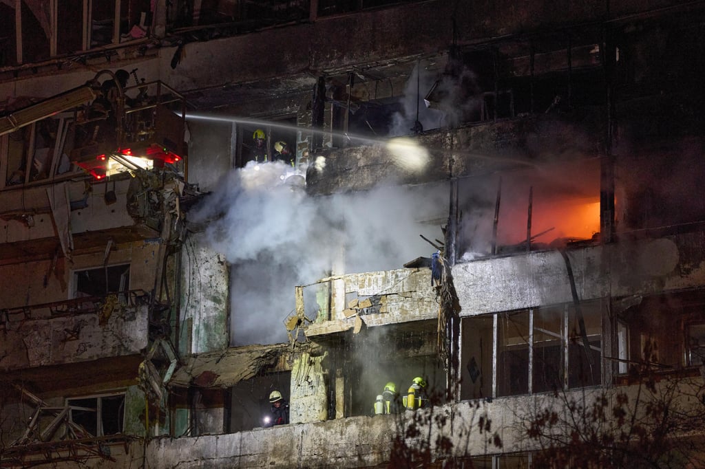 Firefighters put out a fire after a drone hit a multi-storey residential building in Kyiv, Ukraine. Photo: AP