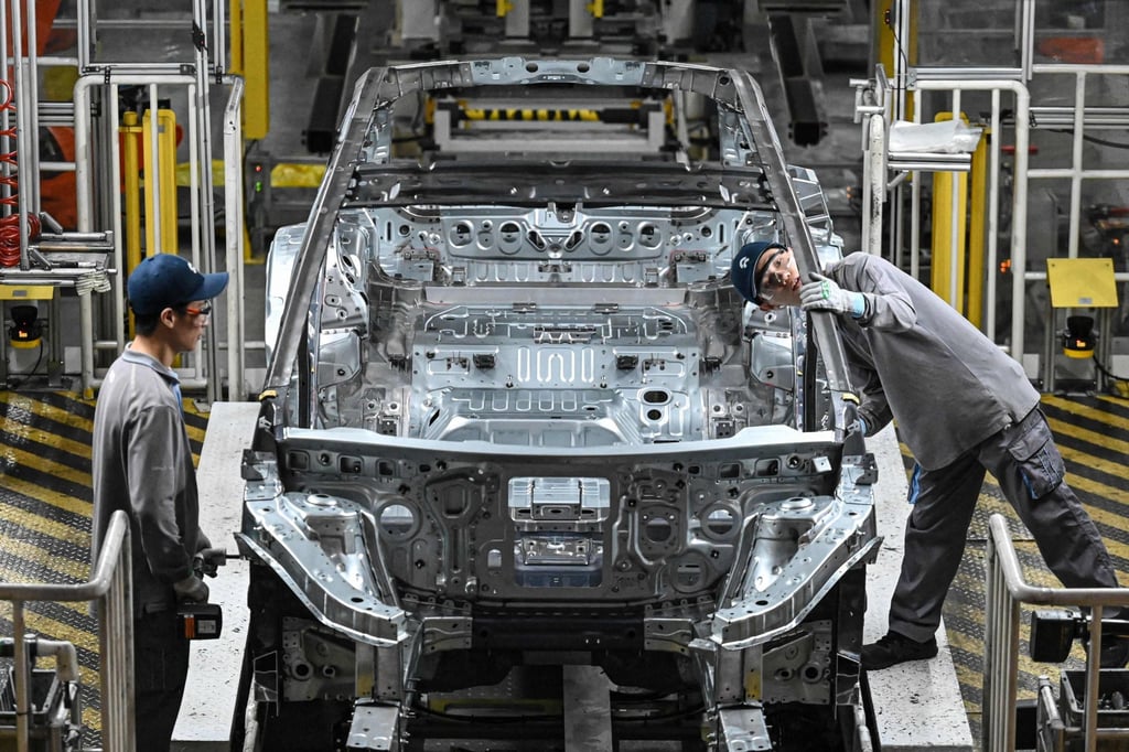 Employees work on an electric vehicle production line at a factory of Chinese carmaker Nio in Hefei, in eastern China’s Anhui province on September 24. Photo: AFP