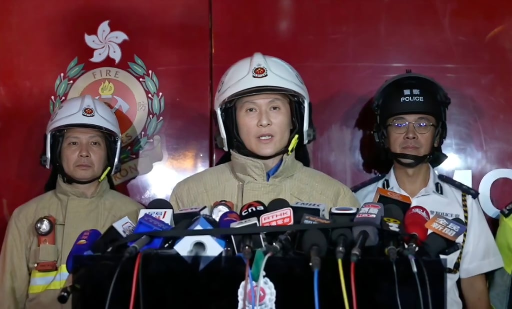 Derek Armstrong Chan, centre, deputy director of fire services. Photo: Handout