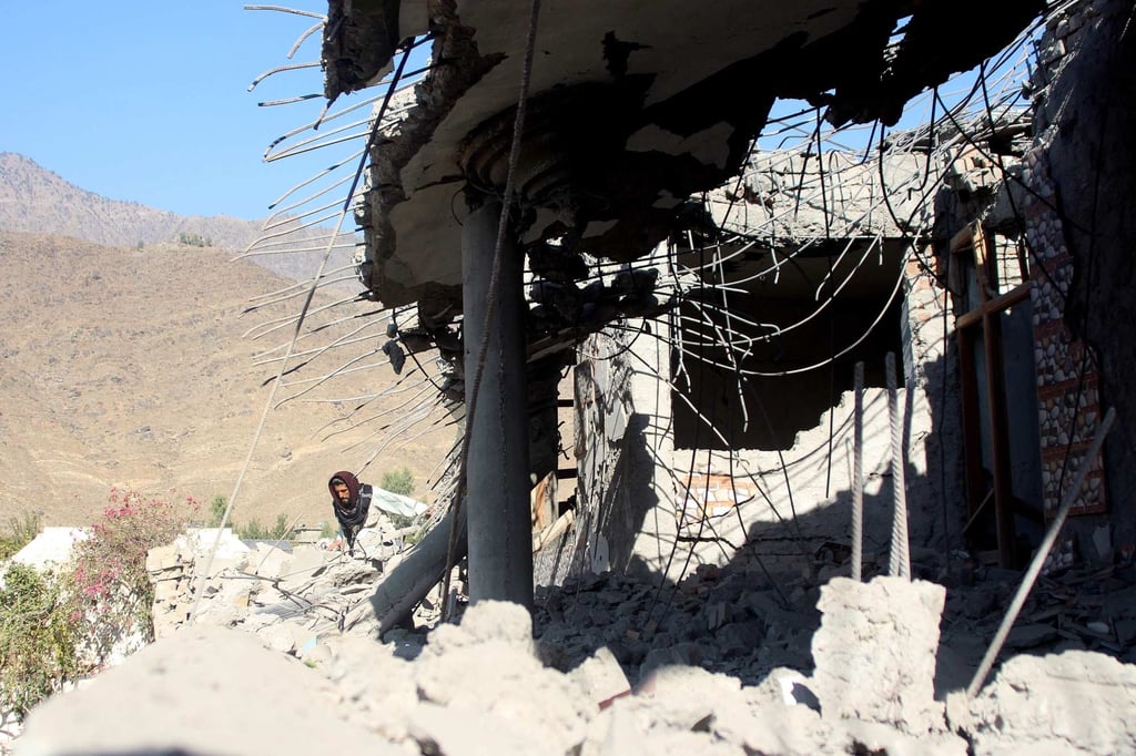 An Afghan man walks at a damaged house after an air strike allegedly by Pakistan, at Asadabad in Kunar province on Tuesday. Islamabad has denied carrying out any attacks. Photo: AFP An Afghan man walks at a damaged house after an air strike allegedly by Pakistan, at Asadabad in Kunar province on Tuesday. Islamabad has denied carrying out any attacks. Photo: AFP
