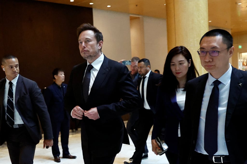 Elon Musk is seen with vice-president Grace Tao and senior vice-president Tom Zhu in Beijing on May 31, 2023. Photo: Reuters Elon Musk is seen with vice-president Grace Tao and senior vice-president Tom Zhu in Beijing on May 31, 2023. Photo: Reuters