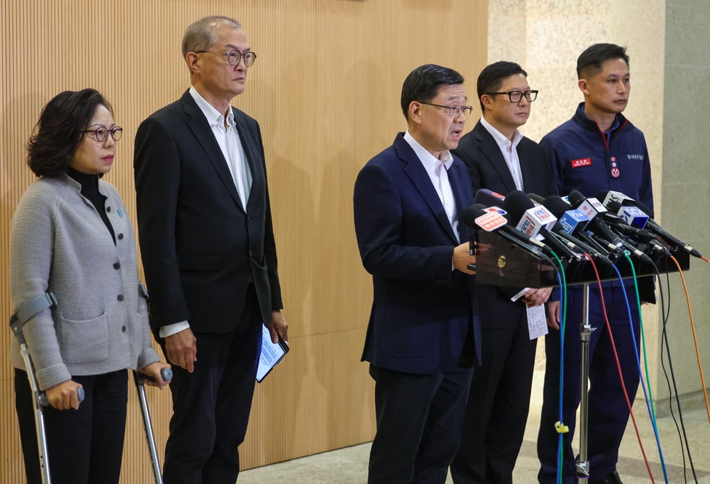 Chief Executive John Lee, centre, meets the media at Prince of Wales Hospital. Photo: Edmond So