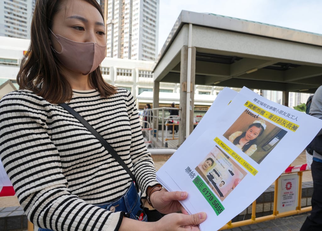 A woman distributes leaflets looking for a missing girl, Hannah, and her helper. Photo: Sam Tsang A woman distributes leaflets looking for a missing girl, Hannah, and her helper. Photo: Sam Tsang