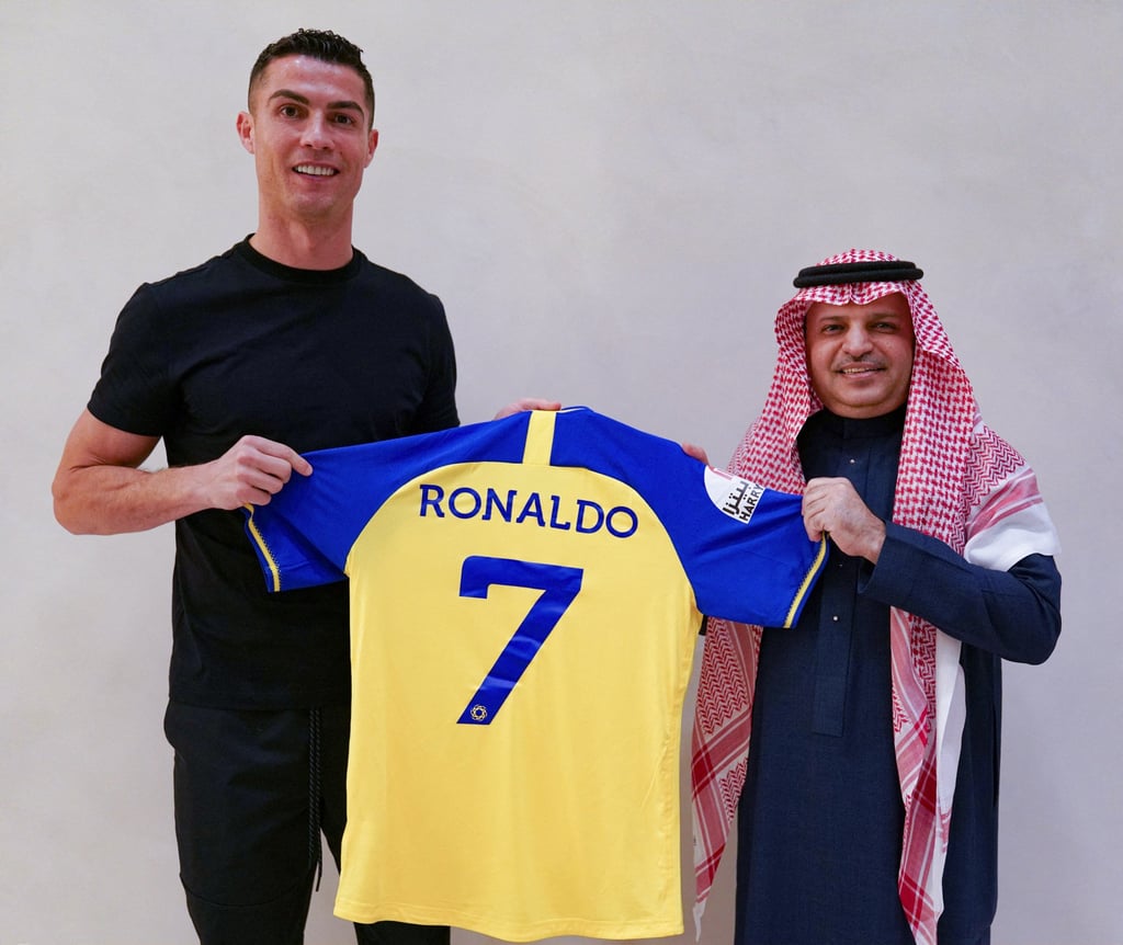 Ronaldo being presented with Al-Nassr’s No 7 jersey on signing with the club in 2022. Photo: AFP