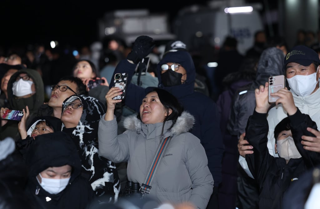 People watch the fourth launch of South Korea’s home-grown Nuri space rocket from Naro Space Centre in Goheung, South Korea, on Thursday. Photo: EPA/Yonhap