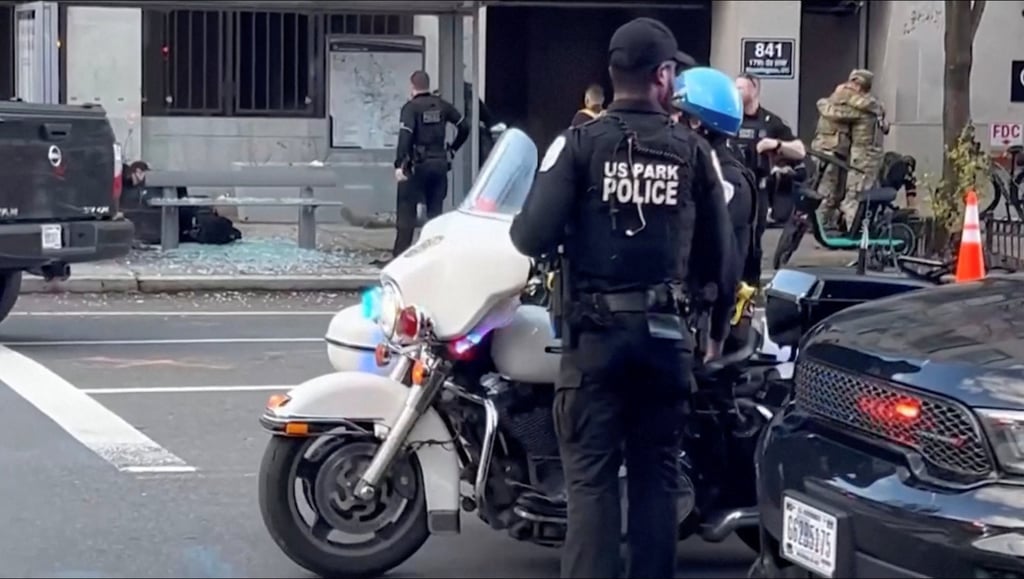Officers at the scene where two National Guard soldiers were shot. Photo: MQ RYAN via Reuters Officers at the scene where two National Guard soldiers were shot. Photo: MQ RYAN via Reuters