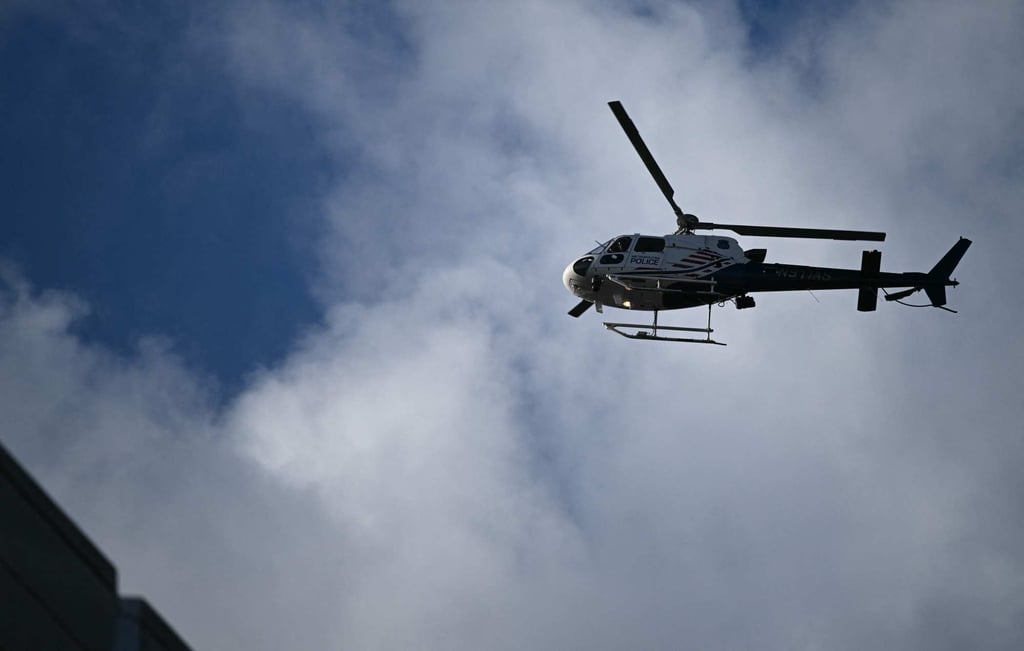 A police helicopter circles above the area after a shooting in Washington on Wednesday. Photo: AFP