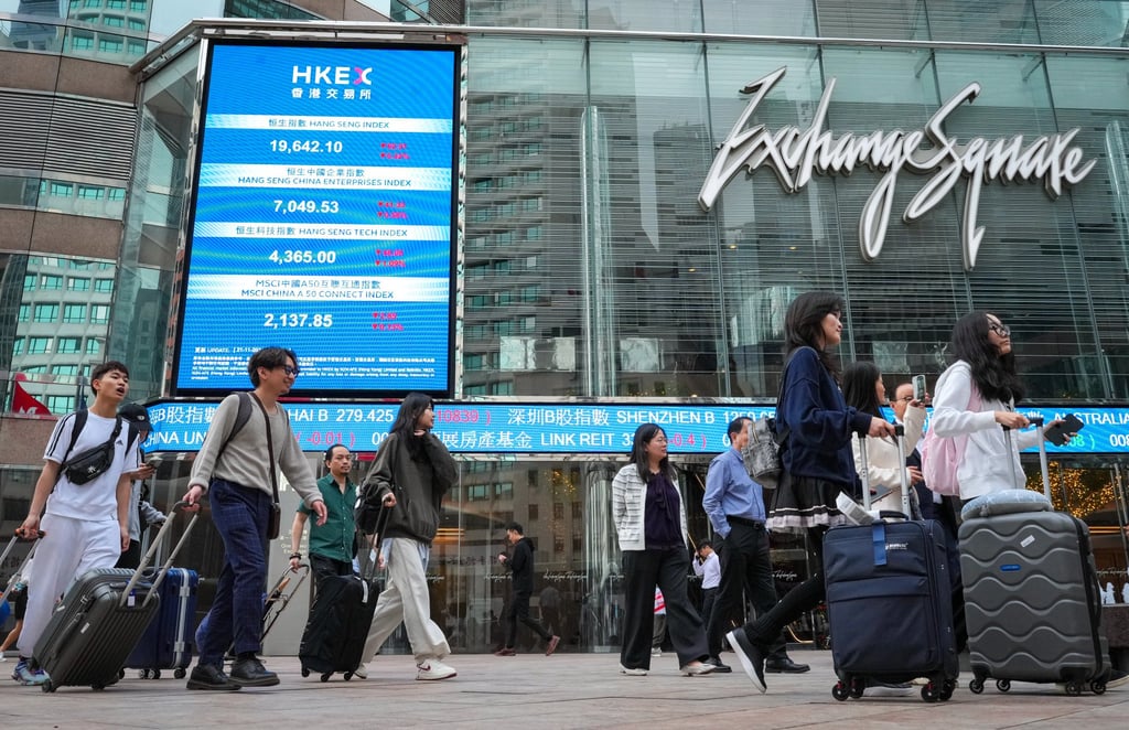 People walk by Hong Kong Exchanges and Clearing Limited in Central on November 21. Photo: May Tse