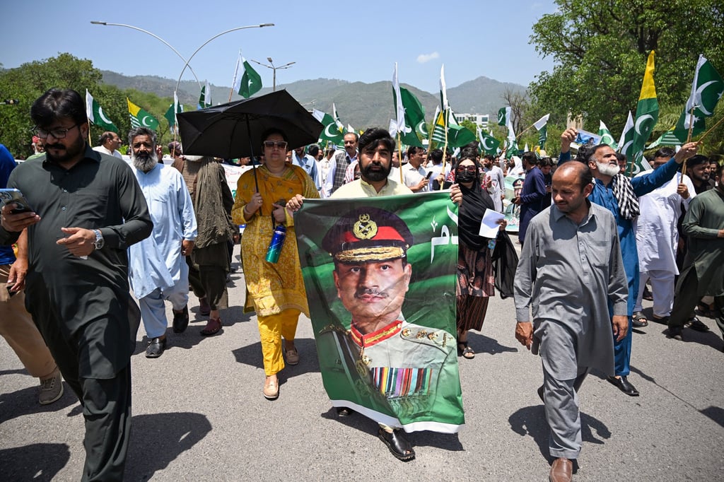 A man carries a portrait of Pakistani Army Chief General Syed Asim Munir during a rally in Islamabad to express solidarity with Pakistan’s armed forces in May. Photo: Getty Images/TNS/AFP