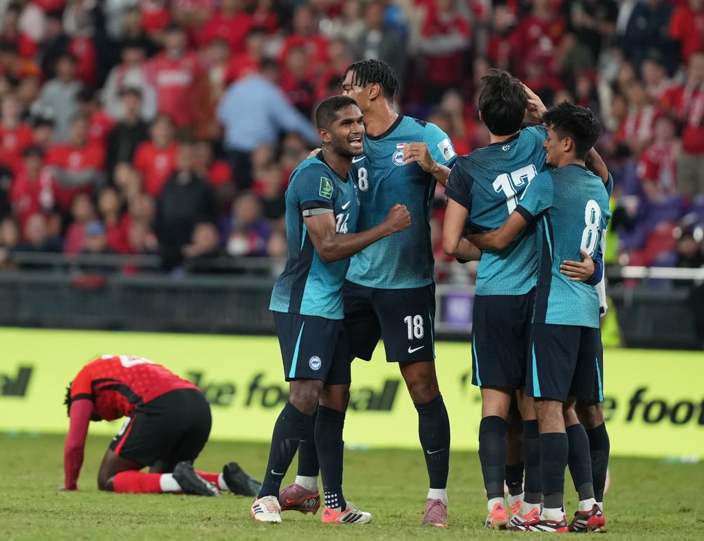 Singapore’s players celebrate after qualifying for the 2027 Asian Cup with a 2-1 win against Hong Kong at Kai Tak Stadium on November 18. Photo: Sam Tsang
