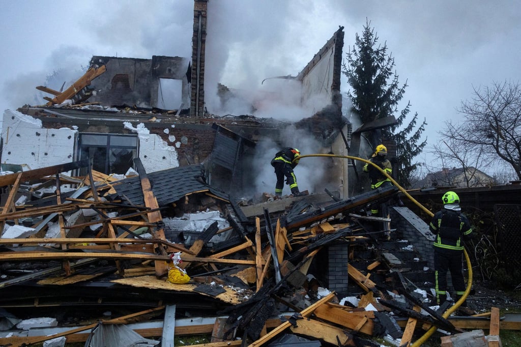 Firefighters work at the site of a home that went up in flames after it was hit by a Russian drone during a night of attacks on Kyiv. Photo: Reuters Firefighters work at the site of a home that went up in flames after it was hit by a Russian drone during a night of attacks on Kyiv. Photo: Reuters