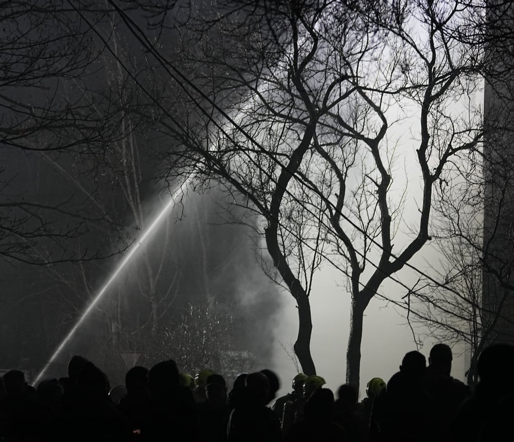 Firefighters put out a blaze after a Russian attack in Vyshgorod early on Sunday. Photo: AP Firefighters put out a blaze after a Russian attack in Vyshgorod early on Sunday. Photo: AP