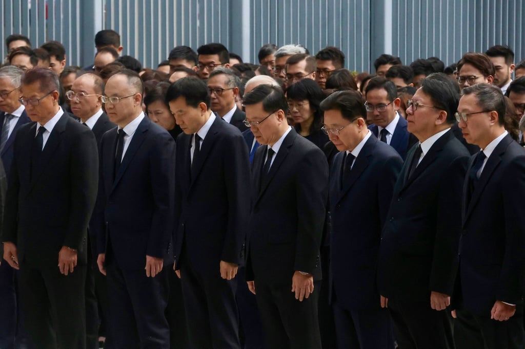 Officials observe three minutes of silence. Photo: Jonathan Wong