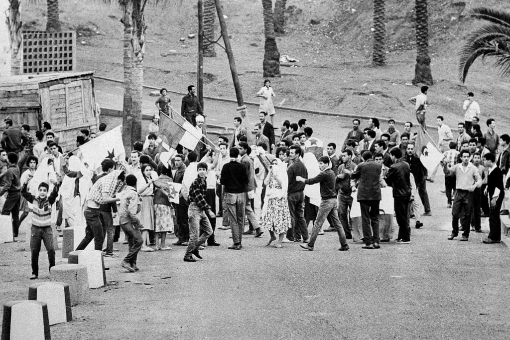 Young Muslims in a suburb of Algiers in 1961, ignoring French orders to stay at home. Photo: AP Young Muslims in a suburb of Algiers in 1961, ignoring French orders to stay at home. Photo: AP