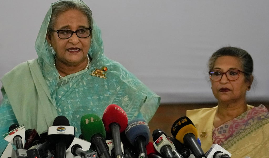 Bangladesh’s former prime minister Sheikh Hasina (left) is accompanied by her sister, Sheikh Rehana, as she speaks to the media in January 2024. Photo: AP