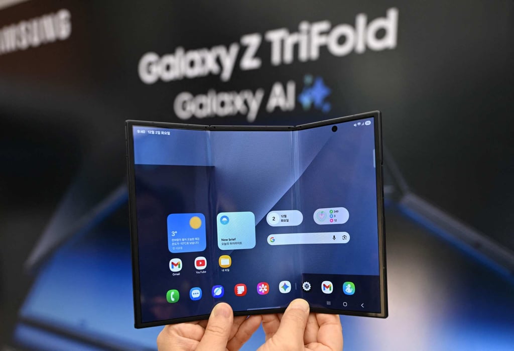 A visitor holds a Samsung Galaxy Z TriFold smartphone during a launch event at a Samsung store in Seoul on Tuesday. Photo: AFP A visitor holds a Samsung Galaxy Z TriFold smartphone during a launch event at a Samsung store in Seoul on Tuesday. Photo: AFP