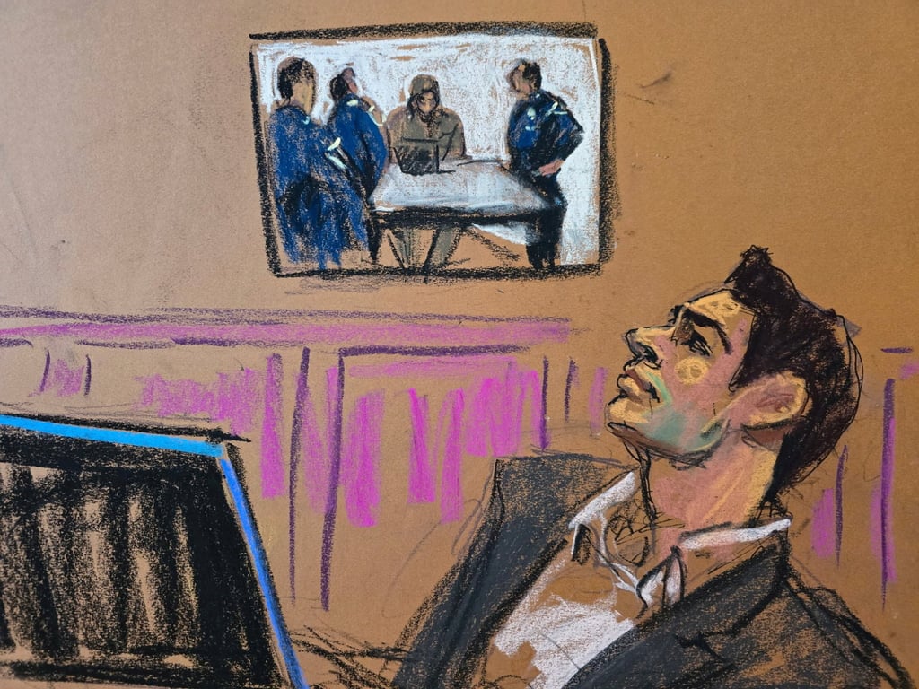 Luigi Mangione watches a video of himself speaking with police in a McDonald’s restaurant shown during state court hearings. Image: Jane Rosenberg via Reuters