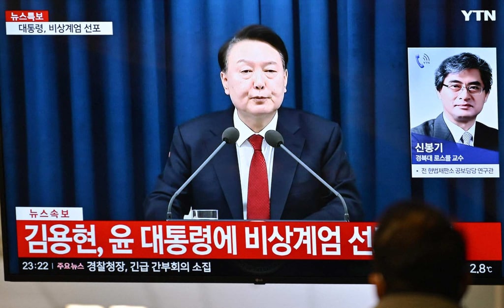 A man watches a broadcast of then South Korean president Yoon Suk-yeol declaring emergency martial law on December 3, 2024. Photo: AFP A man watches a broadcast of then South Korean president Yoon Suk-yeol declaring emergency martial law on December 3, 2024. Photo: AFP
