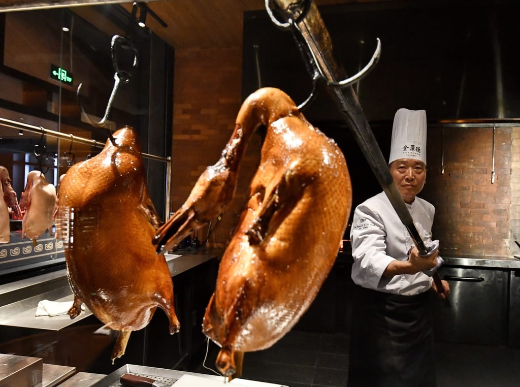 Peking duck restaurant chain China Quanjude is among those offering promotions to shareholders. Photo: Xinhua