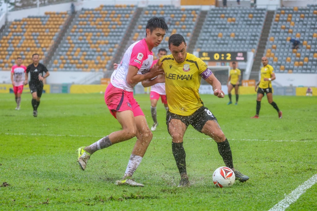 Jason Kam (left) grapples with Lee Man’s Everton Camargo during Kitchee’s win in September. Photo: Edmond So