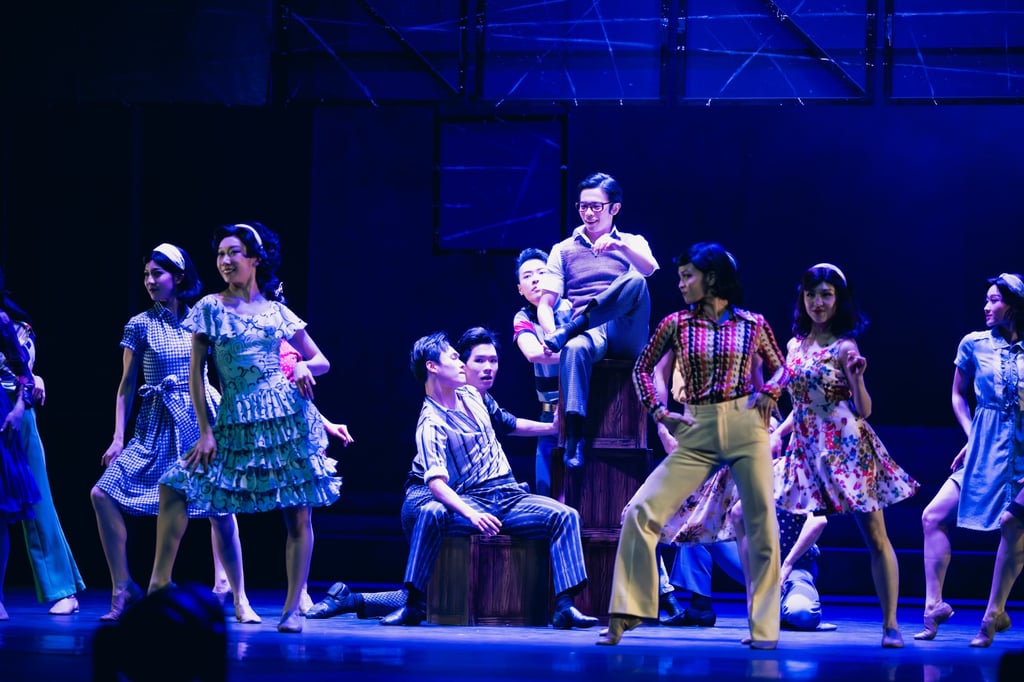 Ong Tze-shen (centre, in glasses) performs as the young Bruce Lee in a scene from the show. Photo: Ray Cheung