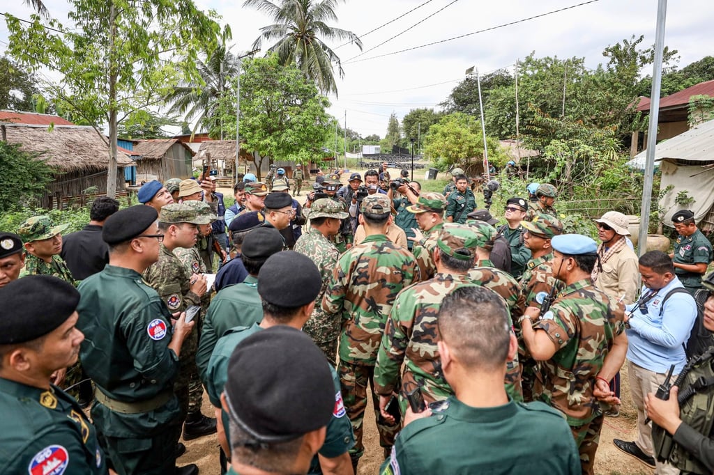 Members of the Asean observer team gather at a village for inspection in Banteay Meanchey province, Cambodia, last month. Photo: EPA