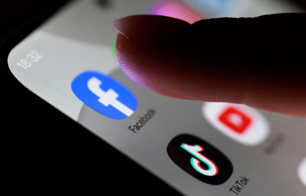 Facebook, TikTok and YouTube app icons are seen on a smartphone. Australia has passed a law prohibiting platforms from allowing under-16s to hold accounts. Photo: Reuters Facebook, TikTok and YouTube app icons are seen on a smartphone. Australia has passed a law prohibiting platforms from allowing under-16s to hold accounts. Photo: Reuters