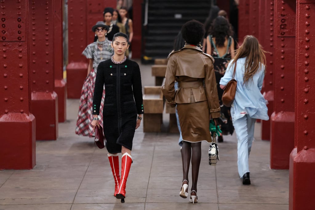 Models walked on a subway platform clad in practical yet luxurious looks. Photo: Reuters Models walked on a subway platform clad in practical yet luxurious looks. Photo: Reuters